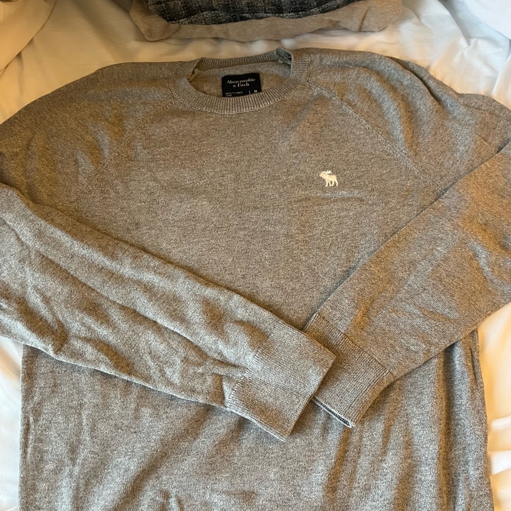 Grey sweater.